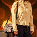 Topo Designs Block Bag crossbody bag in durable fabric, featuring adjustable strap and multiple compartments.