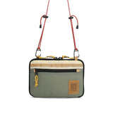 Topo Designs All Adventure Accessory Bag in Beetle color, a compact crossbody bag with multiple compartments and adjustable strap.