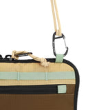 Topo Designs All Adventure Accessory Bag in desert palm, a compact crossbody bag with multiple compartments and rugged design.