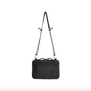 Topo Designs All Adventure Accessory Bag, a compact crossbody bag with adjustable strap and multiple compartments, in durable material.