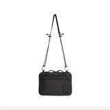 Topo Designs All Adventure Accessory Bag, a compact crossbody bag with adjustable strap and multiple compartments, in durable material.