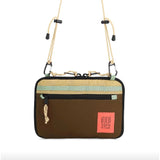 Topo Designs All Adventure Accessory Bag, a compact crossbody bag with zippered compartments and durable fabric, ideal for travel.