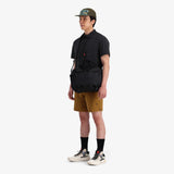 Black Topo Designs Mountain Cross Bag, unisex crossbody bag with adjustable strap and multiple compartments.