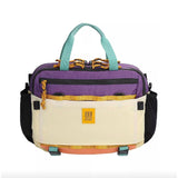 Topo Designs Mountain Cross Bag, a compact black crossbody bag with adjustable strap and durable outdoor fabric.