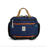 Topo Designs Mountain Cross Bag, a durable crossbody bag with rugged design and adjustable strap, ideal for outdoor adventures.
