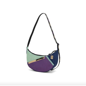 Topo Designs Moonlight Crossbody Bag in dark fabric with adjustable strap and front pocket, stylish and functional for everyday use.
