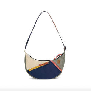 Topo Designs Moonlight Crossbody Bag with adjustable strap and zippered pocket, shown in sleek dark fabric.