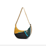 Topo Designs Moonlight Crossbody Bag in black with adjustable strap and front pocket, made of durable fabric.