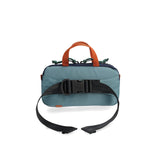 Back view of navy and mustard Topo Designs Mini Quick Pack crossbody bag with adjustable strap and compact design.
