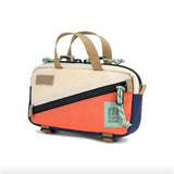 Topo Designs Mini Quick Pack crossbody bag with adjustable strap and compact design, shown in black fabric with zipper closure.