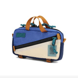 Topo Designs Mini Quick Pack crossbody bag with adjustable strap and compact design, featuring durable fabric and multiple compartments.