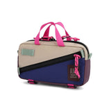 Topo Designs Mini Quick Pack crossbody bag, compact and stylish with adjustable strap, in durable fabric, shown on a plain background.