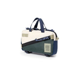 Topo Designs Mini Quick Pack crossbody bag with adjustable strap and compact design, shown in natural canvas material.