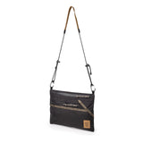 Topo Designs Mountain Accessory Shoulder Bag, a compact crossbody bag with adjustable strap and durable design for outdoor use