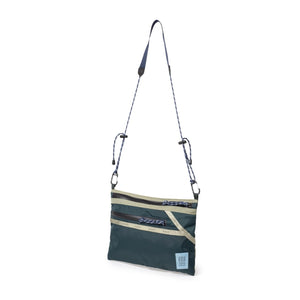 Topo Designs mountain accessory shoulder bag, a compact crossbody bag with adjustable strap and outdoor-inspired design.