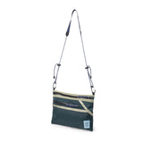 Topo Designs mountain accessory shoulder bag, a compact crossbody bag with adjustable strap and outdoor-inspired design.