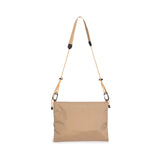 Topo Designs Mountain Accessory Shoulder Bag, a crossbody bag with durable fabric and adjustable strap, displayed on a neutral background.