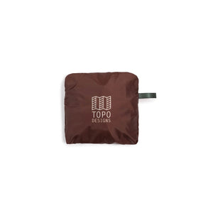 Topo Designs packable tote bag shown open with handles extended and compact design in durable fabric.