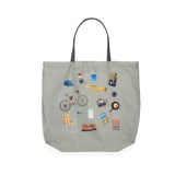 Topo Designs packable tote bag shown with its compact, foldable design and sturdy handles for easy carrying.