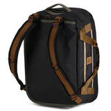Topo Designs Mountain Duffel 40L, durable navy blue travel duffel bag with leather accents and adjustable shoulder strap.