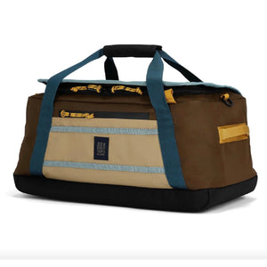 Topo Designs Mountain Duffel 40L in rugged fabric with carry handles and adjustable shoulder strap, ideal for travel and outdoor adventures.