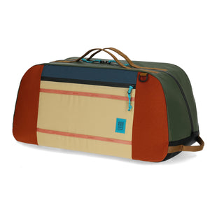 Topo Designs Mountain Duffel 70L in durable fabric, showing its large main compartment and sturdy handles for travel and outdoor use.