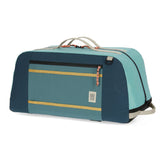 Topo Designs Mountain Duffel 70L in durable fabric with sturdy handles and spacious main compartment for travel and outdoor adventures.