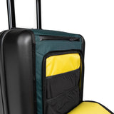 Topo Designs Global Pro Travel Roller Bag shown with spacious main compartment, durable wheels, and sleek black exterior.