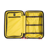 Large Topo Designs Global Pro Travel Roller Bag with extended handle and multiple compartments, suitable for international travel.