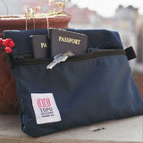 Topo Designs navy accessory bag bundle in medium size, featuring organized compartments and a passport holder for travel essentials.
