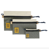 Topo Designs accessory bag bundle with micro, small, and medium packing organizers in durable fabric, suitable for travel and organization.