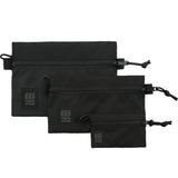 Topo Designs accessory bag bundle with small, medium, and large packing organizers for travel and organization.