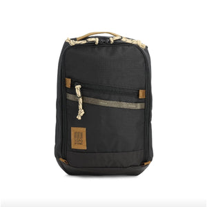 Topo Designs Mountain Sling Bag showing compact, durable outdoor-style sling bag with adjustable strap and multiple compartments.