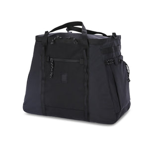 Topo Designs mountain gear tote bag in durable fabric, featuring sturdy handles and practical design for outdoor adventures.