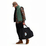 Topo Designs mountain gear tote bag with sturdy handles and spacious main compartment for outdoor adventures.