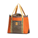 Topo Designs Mountain Utility Tote bag with sturdy handles, large main compartment, and outdoor-inspired design for versatile use.