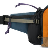Topo Designs Mountain Hydro Hip Pack waist pack in Pond Blue with orange accents, showing detailed side view.