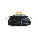 Back view of Topo Designs Mountain Hydro Hip Pack in stone blue and bone white, showing adjustable waist strap and compact design.