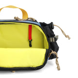 Topo Designs Mountain Hydro Hip Pack waist pack in stone blue and bone white with adjustable strap and multiple storage compartments.