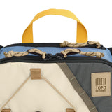 Topo Designs Mountain Hydro Hip Pack waist pack in stone blue and bone white with front zipper pocket and adjustable strap.