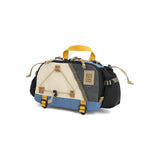 Topo Designs Mountain Hydro Hip Pack waist pack in stone blue and bone white, with adjustable strap and compact storage.