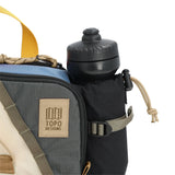 Topo Designs Mountain Hydro Hip Pack waist pack in stone blue and bone white with adjustable strap and multiple compartments.