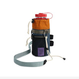 Topo Designs Mountain Hydro Sling water bottle sling with adjustable strap, designed for outdoor hydration and portability.