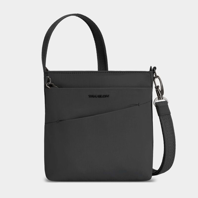 Travelon Roam small crossbody bag with adjustable strap and multiple compartments, shown in black fabric.