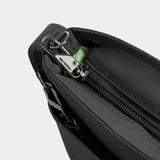 Travelon Roam Small Crossbody bag with adjustable strap and multiple compartments, shown in black with zipper closures.