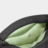 Travelon Roam small crossbody bag with adjustable strap, featuring multiple compartments and sleek design.