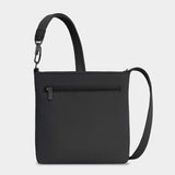 Travelon Roam small crossbody bag in black with adjustable strap and multiple compartments, shown from front view.