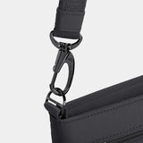 Travelon Roam Small Crossbody bag in black with adjustable strap and multiple compartments, displayed on a white background.