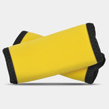 Black Travelon handle wraps providing comfortable grip and protection for luggage handles.