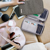 Travelon family passport zip wallet with multiple compartments and secure zipper closure for travel organization.
